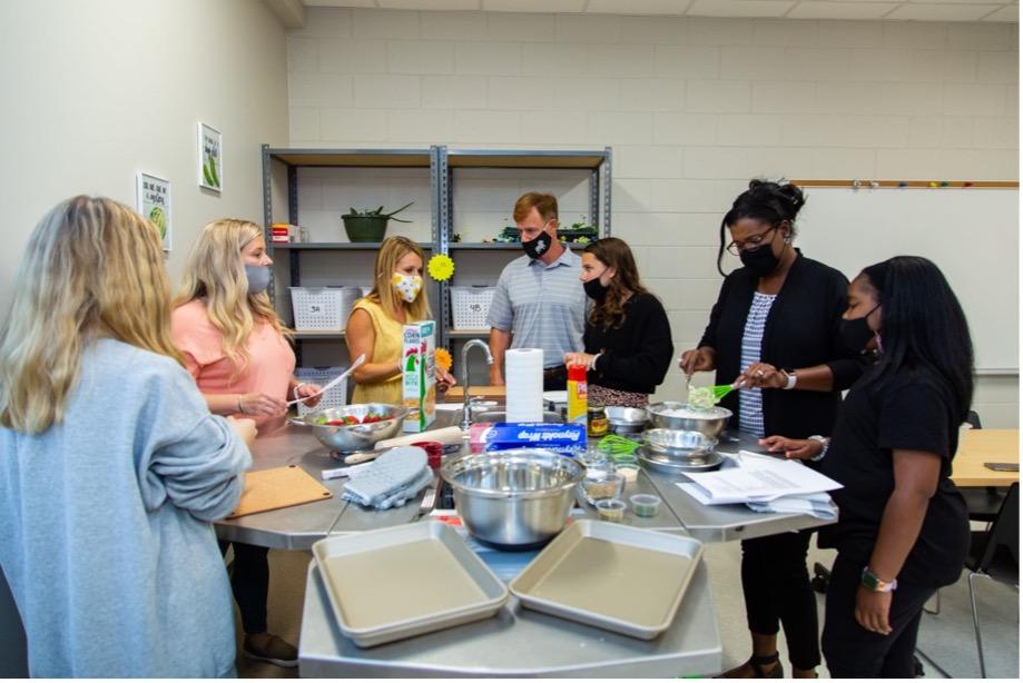 Parents and Students cooking at family night