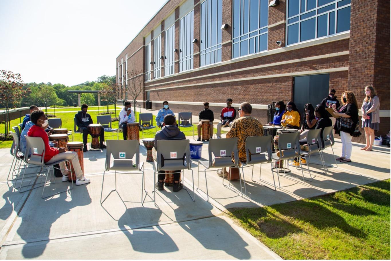 MSU Professor teaching middle school students music