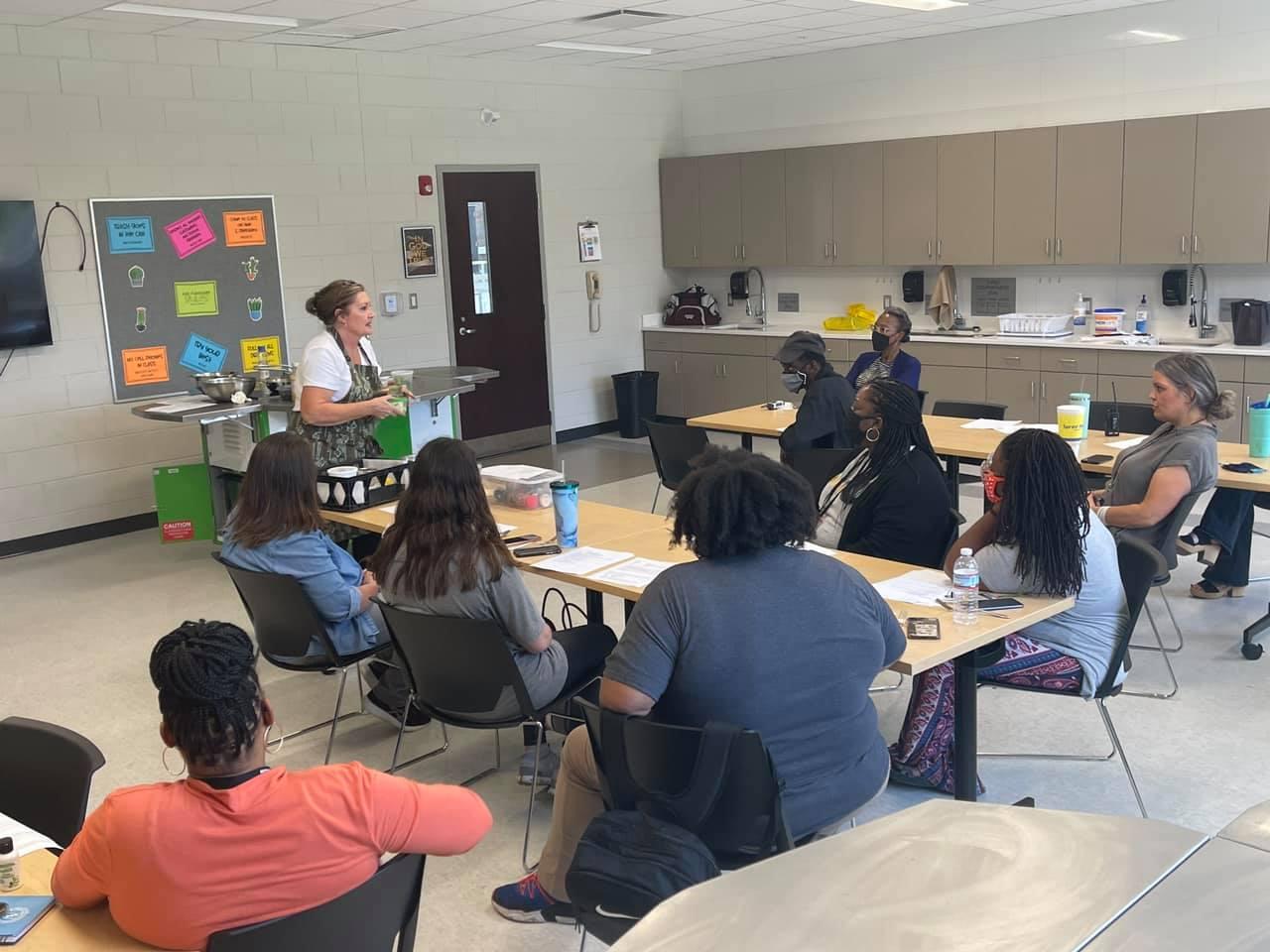 MSU Chef teaching cooking nutrition class to Partnership Staff